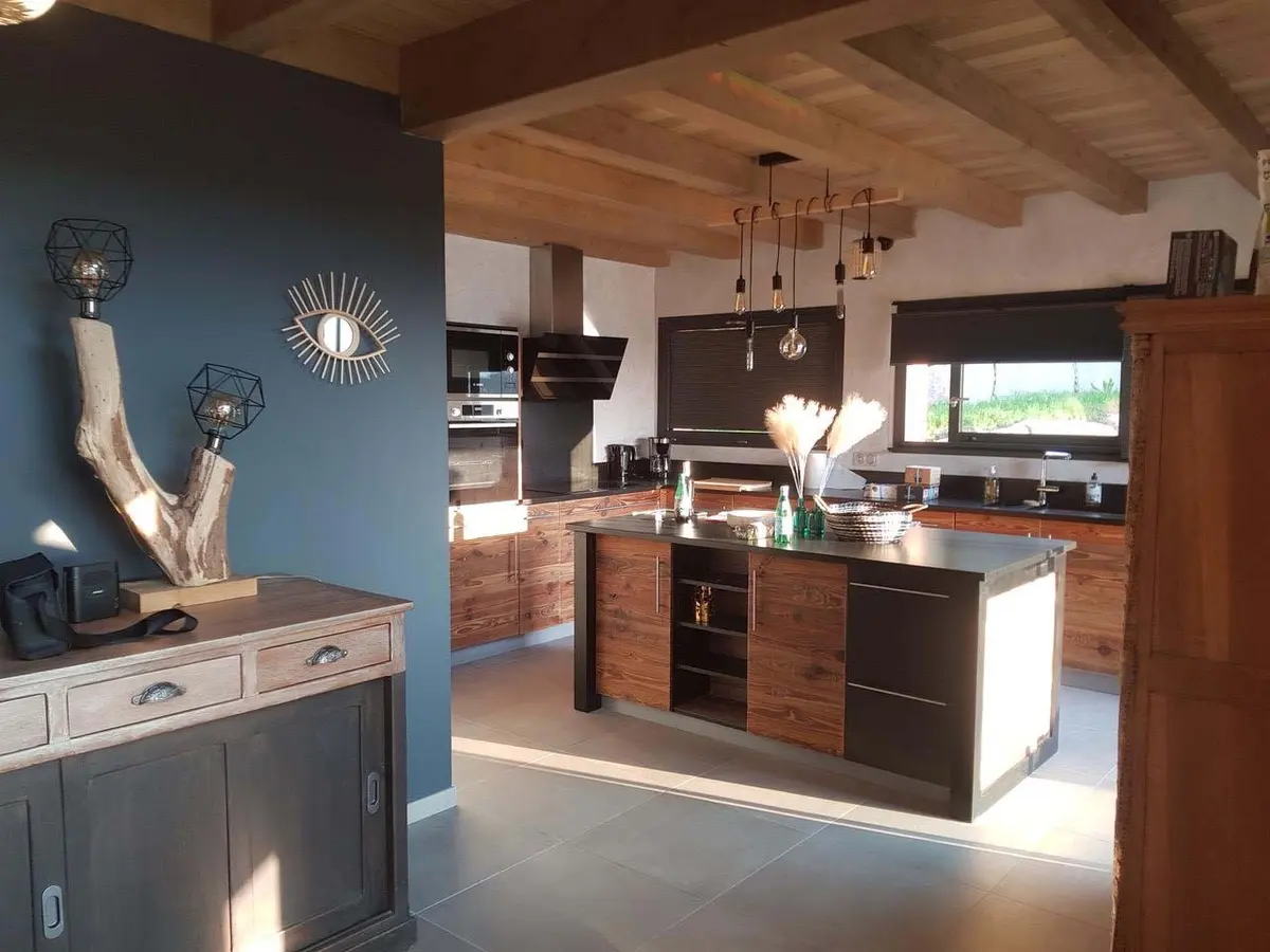 The chalet's open kitchen with central island and valley view