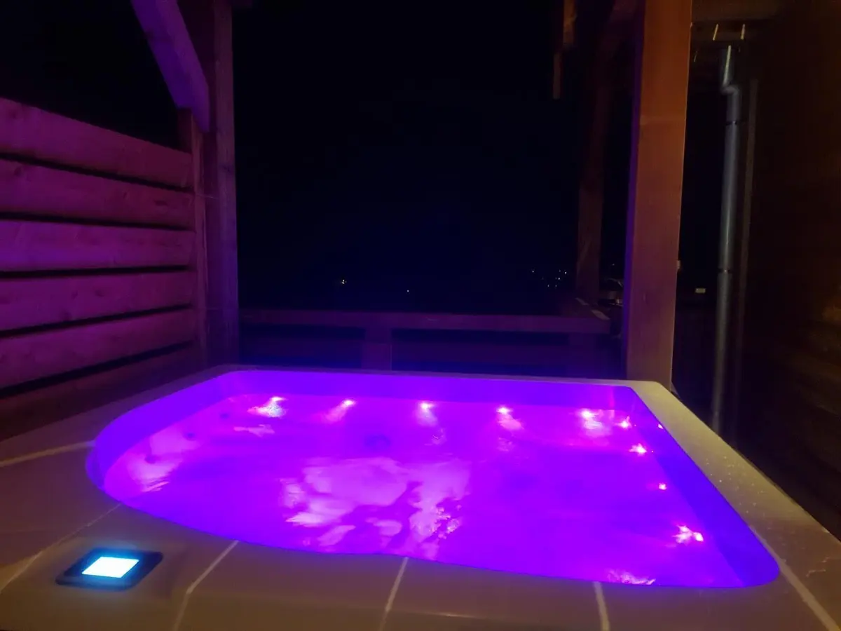 The chalet's heated hot tub with mood lighting