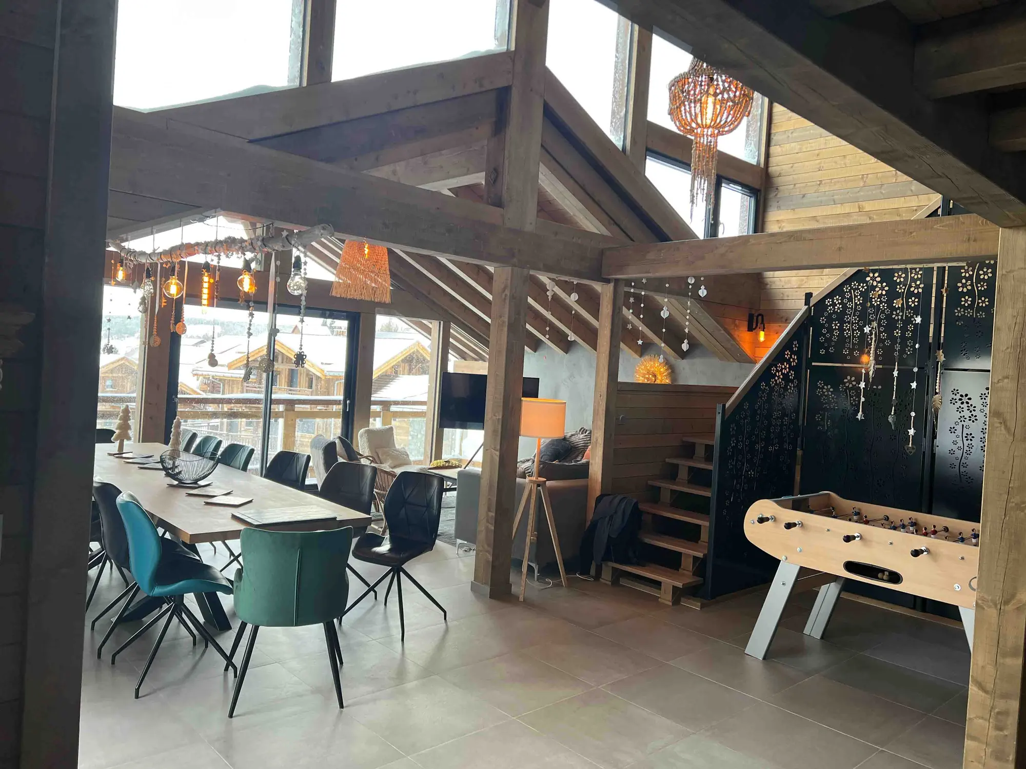Chalet games area with foosball table and mezzanine